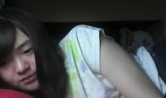 Asian girl fingering her wide open hairy pussy