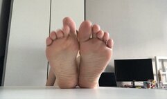 Soles on desk!