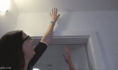 A very tall and big girl makes fun of a short girl