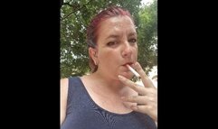 Smoking a Marlboro in a public park 4K