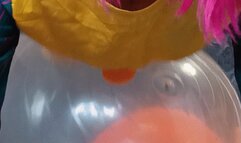 girl in clown costume deflate yoga balls