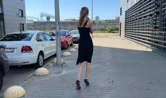 The girl in high-heeled shoes twisted her leg badly and now can't walk properly