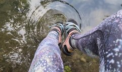 Fifi playing in the creek after yoga in leggings and socks with sandals