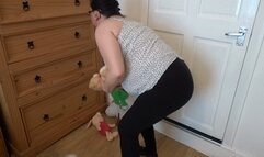 wife undressing in the bedroom in leggings