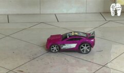 Toy Car under hard wooden clogs