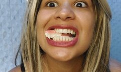 Chewing teeth gummies with an open MOUTH