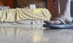 Dirty bare feet in the bedroom