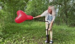 Alla destroys three balloons with a hand pump