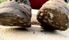Gwendolyn is cleaning dirt off her dirty shoes right onto a tiny man