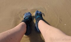 Fifi getting her socks all sandy and wet on the beach replay