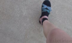 Fifi driving in Teva sandals with black Nike socks replay