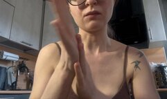 Emma smears cream on her fingers, plays, breaks her hands