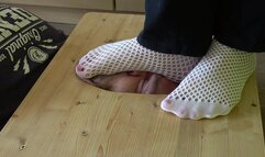 Stomping face in white socks and barefoot (facebox)