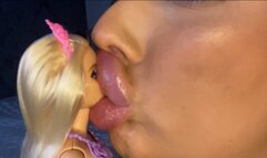 Giantess smooches tiny barbie!