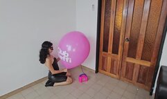 Marianna blows to pop her big pink TIFFANY balloon!