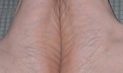 Big feet soles together