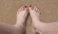Fifi showing off her feet in the sand and waves at the beach replay