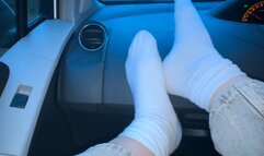Teasing the driver with my white socks