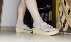 Crusty feet walking in clunky wooden sandals