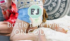 Bottle time lying on couch