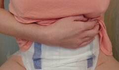 Pinkie pees her diaper on the toilet