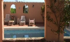 On the table by the hotel pool