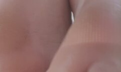 Dirty man feet on the beach