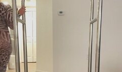 Carissa playing on the luggage cart in the Zebra catsuit!