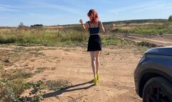 A girl in high-heeled shoes was walking off-road, her heel turned up and she sprained her ankle