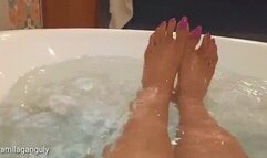 Wet Beautiful Barefeet In Bathtub With Pink Long Toenails