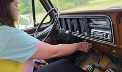 Sexy brunette with tattoos cranking at the park