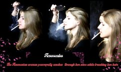 The Amazonian woman powerfully smokes through her nose while brushing her hair