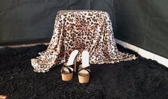 Roxan smoking and with high heels hanging while crossing his legs (3)