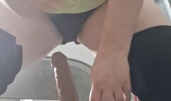 Riding cock on chair puffing cigar