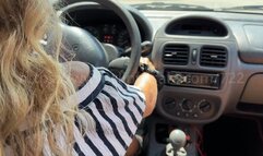 Lou takes the weel and drives in white sandals