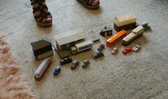 Back by popular demand GIANTESS Charn crushes small cars, buildings, buses in wedges closeup left view