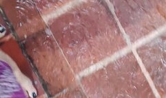 Angelin's beautiful feet playing with water in the rain (1)