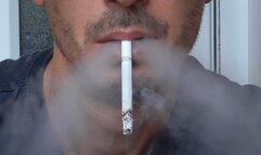 Smoking Muratti red 100s dangling closeup IYF 230924