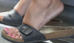 Foot fetish slippers dangling close-up