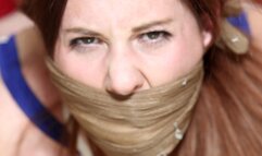 Pantyhose Clad Lilian ends up Tightly Hogtied, Triple Gagged, Groped & Humiliated by a Jilted Co-Worker!