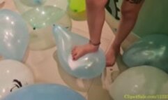 Safira Crushes 32 Balloons Under Her Feet