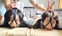 Two girls wearing white stockings were gagged, arms and legs tied and torment