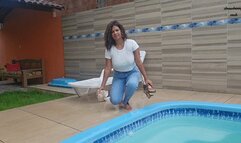 Peril in the pool in jeans, white shirt and zebra panties