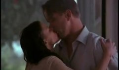 Kari Wuhrer nude and kissing a guy in Spiders Web