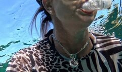 Carissa Dumond in the sheer zebra catsuit underwater in the springs