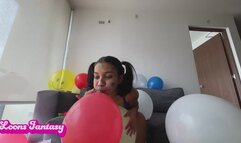 Akina blows up balloons in a jumpsuit