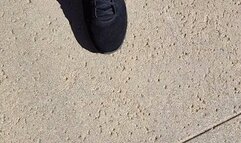 Tempest walking in black sneakers