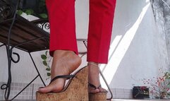 High platform heels dangle from Angelin's oiled feet (1)