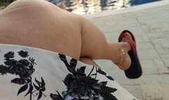 Channels hanging from Angelin's feet while in front of the pool (1)