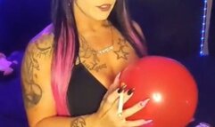 Smoking slut, popping balloon with a cigarette